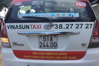 Bộ Công Thương đang xem xét hành vi vi phạm việc dán khẩu hiệu phản đối Uber, Grab