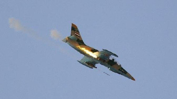Máy bay chiến đấu của Syria đang bắn rocket xuống một mục tiêu ởTel Rifaat hồi năm 2012