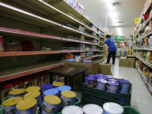 Bê bối sữa liên quan đến aflatoxin khiến doanh nghiệp phải thu hồi sản phẩm năm 2011