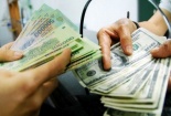 Bắt 2 người liên quan đến vụ đổi 100.000 USD giả tại ngân hàng